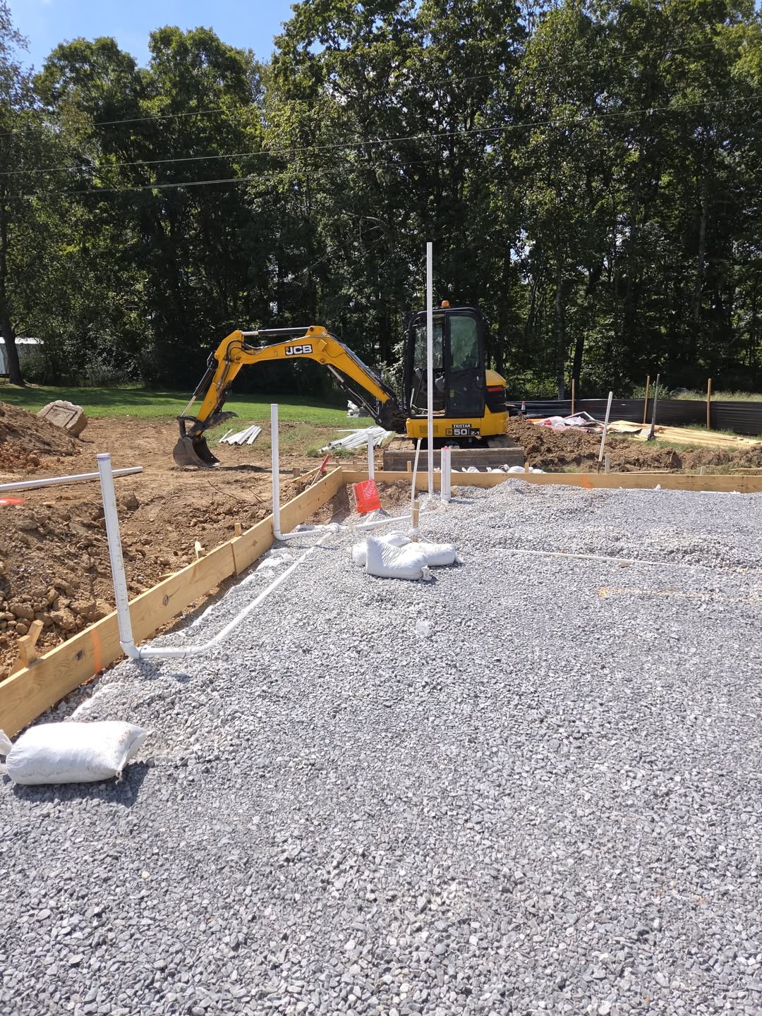 Underground plumbing installed before a concrete slab at a Waterloop job site